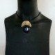 Brass pendan with a blue cat's eye stone. ŽP620-2