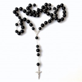 Rosaries to a car with black pebbles