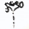 Rosaries to a car with black pebbles
