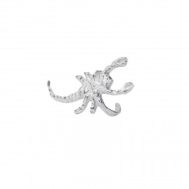 Silver earring on ear cartilage Scorpio